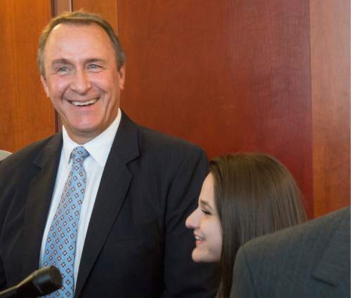 Rick Egan  |  The Salt Lake Tribune

Former Attorney General Mark Shurtleff and his daughter Annie listen as attorney Richard Van Wagoner talks to the media after his scheduling hearing at the Matheson Courthouse, Monday, March 23, 2015. Third District Court Judge Randall Skanchy set a June 15 date for a hearing to determine whether Shurtleff will stand trial on bribery and corruption charges.