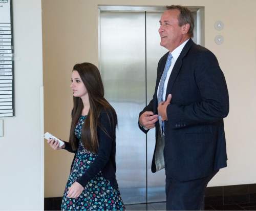 Rick Egan  |  The Salt Lake Tribune

Former Attorney General Mark Shurtleff and his daughter Annie make their way to Judge Randall Skanchy's courtroom at the Matheson Courthouse for Shurtleff's scheduling hearing Monday, March 23, 2015. Third District Court Judge Randall Skanchy set a June 15 date for a hearing to determine whether Shurtleff will stand trial on bribery and corruption charges.