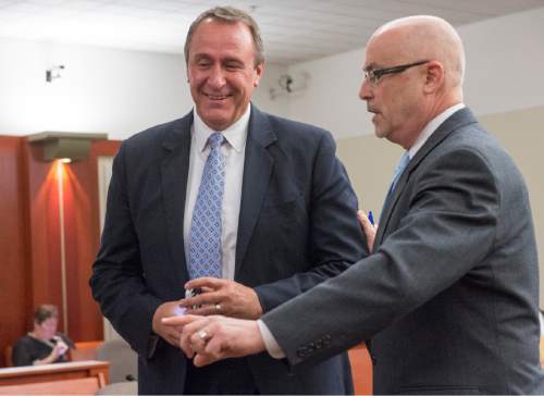 Rick Egan  |  The Salt Lake Tribune

Former Attorney General Mark Shurtleff and his attorney Richard Van Wagoner have a discussion during a scheduling hearing at the Matheson courthouse, Monday, March 23, 2015.  Third District Court Judge Randall Skanchy set a June 15 date for a hearing to determine whether Shurtleff will stand trial on bribery and corruption charges.