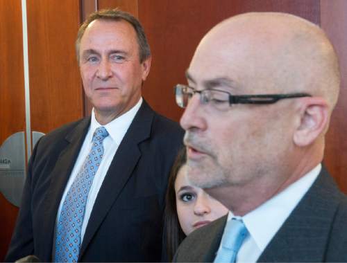 Rick Egan  |  The Salt Lake Tribune

Former Attorney General Mark Shurtleff and his daughter Annie listen as attorney Richard Van Wagoner talks to the media after Shurtleff's scheduling hearing at the Matheson Courthouse, Monday, March 23, 2015. Third District Court Judge Randall Skanchy set a June 15 date for a hearing to determine whether Shurtleff will stand trial on bribery and corruption charges.