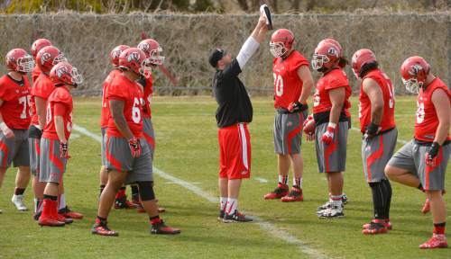 Leah Hogsten  |  The Salt Lake Tribune
The offensive line runs charted plays as the University of Utah football team held their first spring practice, Tuesday, March 24, 2015.