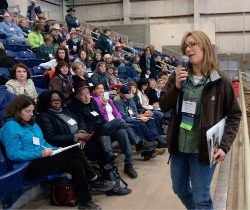 Al Hartmann  |  The Salt Lake Tribune 
Lynn Thomas, co-founder and executive director of the Equine Assisted Growth and Learning Association, speaks to a crowd at the 16th annual conference at Legacy Arena in Farmington Thursday March 26, 2015. EAGALA is a Santaquin-based nonprofit that use horses in therapy for veterans, couples and at-risk youth as well as for team-building. It can be used with or to replace talk therapy. EAGALA says it has more than 4,500 members in 50 countries in Africa, North America, the Middle East, Latin America and Australia, who are using its techniques.