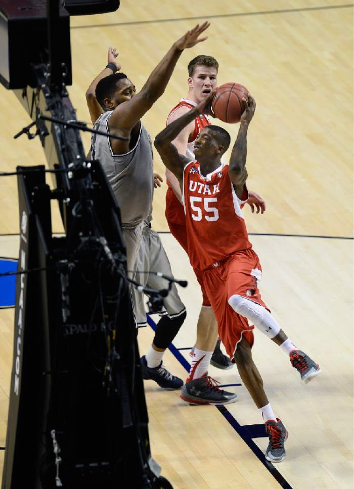 Scott Sommerdorf   |  The Salt Lake Tribune
Utah Utes guard Delon Wright (55) shoots during first half play. Utah and Georgetown were tied 32-32 at the half, Saturday, March 21, 2015.