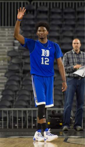 Steve Griffin  |  The Salt Lake Tribune

Duke Blue Devils forward Justise Winslow (12) waves to the crowd as they sing him "Happy Birthday" as Duke practices on the NRG Stadium court prior to their 2015 NCAA Men's Basketball Championship Regional Semifinal game against Utah in Houston, Thursday, March 26, 2015. The Houston native is playing before a hometown crowd.