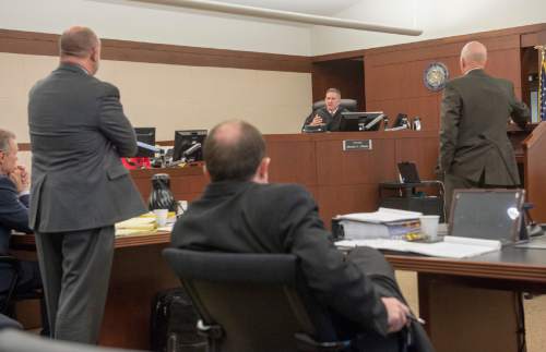 Rick Egan  |  The Salt Lake Tribune

Attorneys discuss details with Judge Michael DiReda during the Douglas Lovell death penalty phase, in the 2nd District Court in Ogden, during court proceedings in the Douglas Anderson Lovell trial, Friday, March 27, 2015.