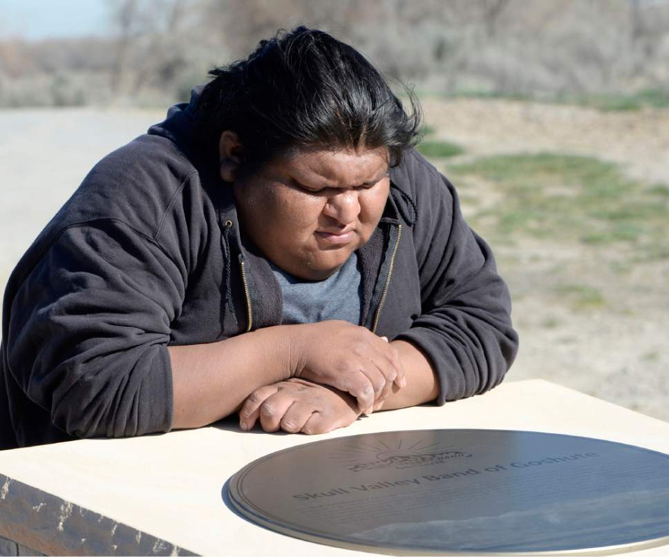 Al Hartmann  |  The Salt Lake Tribune 
Goshute tribal member Dell Bishop stops to read plaque on one of the points of the Galena Sundial Monument on the Jordan River Parkway.  The monument was dedicated Friday March 27. Once there was controversy over FrontRunner violating an Indian burial ground in the area, and this sundial was part of the promised mitigation.