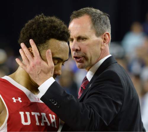 Steve Griffin  |  The Salt Lake Tribune

Utah assistant coach Tommy Connor embraces a dejected Utah Utes guard Brandon Taylor (11) as he fouls out of the game late in the second half action in the University of Utah versus Duke University Sweet 16 game in the 2015 NCAA Men's Basketball Championship Regional Semifinal game at NRG Stadium in Houston, Friday, March 27, 2015.
