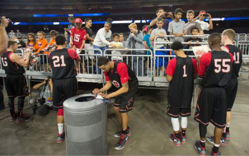Steve Griffin  |  The Salt Lake Tribune

The University of Utah Utes sign autographs after their practice on the NRG Stadium court prior to their 2015 NCAA Men's Basketball Championship Regional Semifinal game against Duke in Houston, Thursday, March 26, 2015.