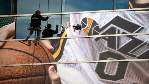 Lennie Mahler  |  The Salt Lake Tribune

Window workers remove the banner of former Jazz center Enes Kanter from EnergySolutions Arena on Friday following his Thursday trade to the Oklahoma City Thunder. The Turkish big man was drafted No. 3 by the Jazz in the 2011 NBA Draft.