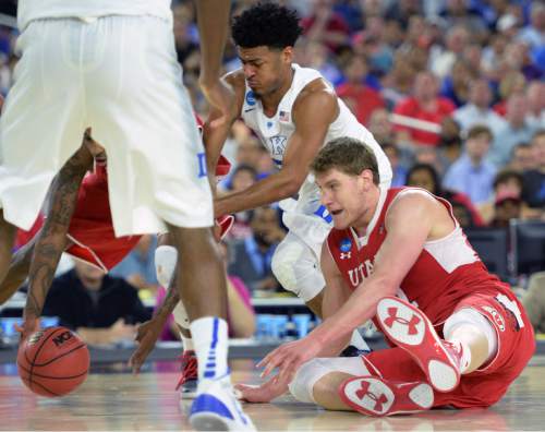 Steve Griffin  |  The Salt Lake Tribune

Utah Utes center Dallin Bachynski (31) falls tot he court as he goes for a loose ball during second half action in the University of Utah versus Duke University Sweet 16 game in the 2015 NCAA Men's Basketball Championship Regional Semifinal game at NRG Stadium in Houston, Friday, March 27, 2015.