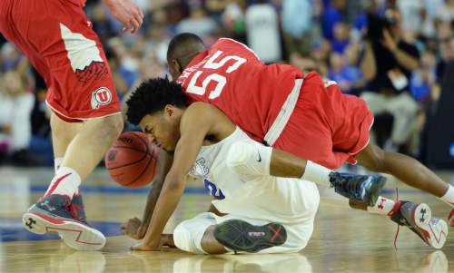 Steve Griffin  |  The Salt Lake Tribune

Utah Utes guard Delon Wright (55) lands on Duke Blue Devils guard Quinn Cook (2) as they go for the ball during second half action in the University of Utah versus Duke University Sweet 16 game in the 2015 NCAA Men's Basketball Championship Regional Semifinal game at NRG Stadium in Houston, Friday, March 27, 2015.