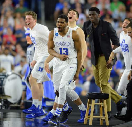 Steve Griffin  |  The Salt Lake Tribune

The Duke bench leaps onto the court after Duke Blue Devils forward Amile Jefferson (21) throws down a monster dunk during second half action in the University of Utah versus Duke University Sweet 16 game in the 2015 NCAA Men's Basketball Championship Regional Semifinal game at NRG Stadium in Houston, Friday, March 27, 2015.