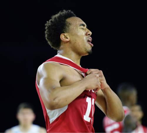 Steve Griffin  |  The Salt Lake Tribune

Utah Utes guard Brandon Taylor (11) pulls on his jersey after being called for a foul late in the second half action in the University of Utah versus Duke University Sweet 16 game in the 2015 NCAA Men's Basketball Championship Regional Semifinal game at NRG Stadium in Houston, Friday, March 27, 2015.