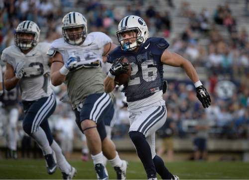 Scott Sommerdorf   |  The Salt Lake Tribune
BYU RB Nate Carter broke off a huge run to get the ball into scoring position as BYU football had it's first scrimmage, Friday, March 27, 2015.