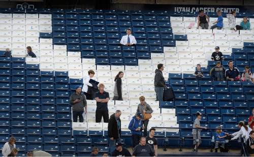 Scott Sommerdorf   |  The Salt Lake Tribune
A smattering of fans watched from the less-full east stands as BYU football had it's first scrimmage, Friday, March 27, 2015.