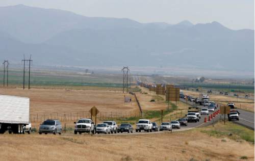 Northbound 1-15 traffic is backed up for miles July 8, 2007, near Beaver, Utah, due to the Milford Flat wildfire.   Rick Egan/The Salt Lake Tribune