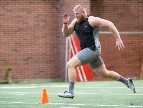 Rick Egan  |  The Salt Lake Tribune

Weber State defensive end Dustin Martin runs the 40-yard- dash for NFL scouts during Pro Day at the Spence Eccles Field House, Thursday, March 26, 2015.