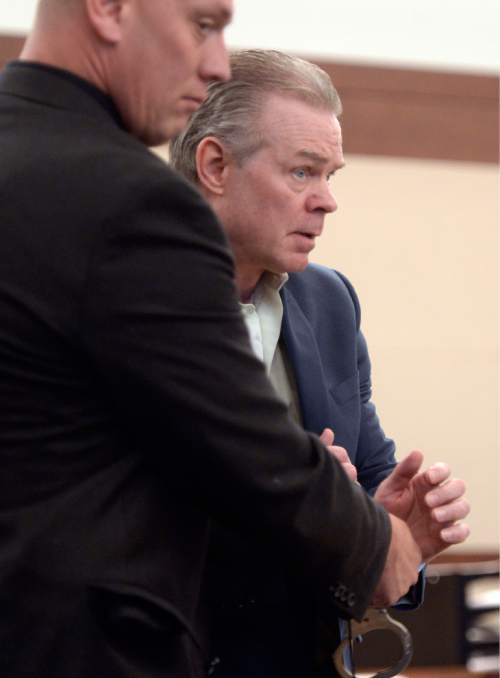 Al Hartmann  |  The Salt Lake Tribune 
Douglas Anderson Lovell, 57, has been convicted of aggravated murder for kidnapping and killing 39-year-old Joyce Yost in 1985 to keep her from testifying against him in a rape case. He enters courtroom in Ogden Monday March 30 during the penalty phase of his death penalty trial.
