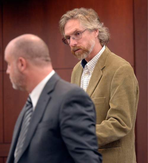 Al Hartmann  |  The Salt Lake Tribune 
Defense lawyer Michael Bouwhuis, left, interviews witness Dr. David Stoner, a wildlife ecologist who specializes in mountain lion behavior Monday March 30 during the penalty phase of his client Douglas Anderson Lovell.    Lovell, 57, has been convicted of aggravated murder for kidnapping and killing 39-year-old Joyce Yost in 1985 to keep her from testifying against him in a rape case.