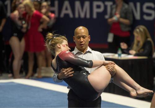 Rick Egan  |  The Salt Lake Tribune

Utah assistant coach  Tom Farden carries Tory Wilson off the floor, after she was injured early in her floor routine, in the Pac-12 Gymnastics Championships at the Huntsman Center, Saturday, March 21, 2015.