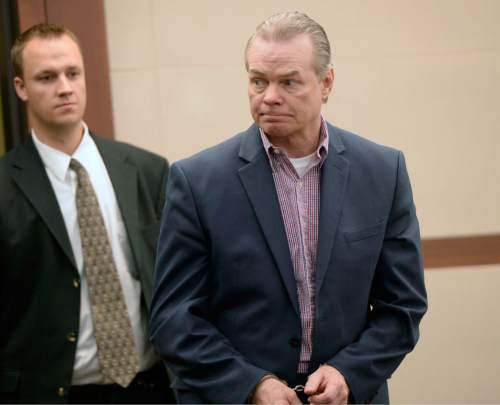 Al Hartmann  |  The Salt Lake Tribune 
Douglas Anderson Lovell, 57, convicted of aggravated murder for kidnapping and killing 39-year-old Joyce Yost in 1985 to keep her from testifying against him in a rape case, enters the courtroom in Ogden Tuesday March 31, 2015, for the last day of his death penalty trial. The prosecution and defense gave their closing arguments Tuesday.