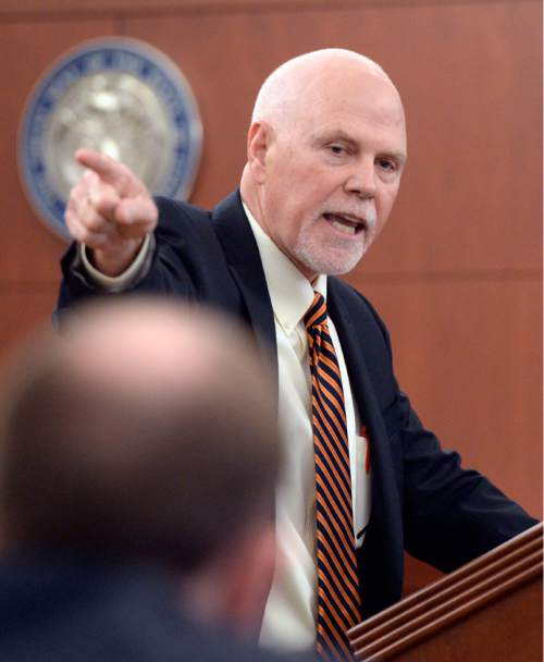 Al Hartmann  |  The Salt Lake Tribune 
 Deputy Weber County Attorney Christopher Shaw gives closing arguments to the jury in Ogden Tuesday March 31, 2015, asking for the death penalty for Douglas Anderson Lovell. He points to him at the defense table. Lovell, 57, has been convicted of aggravated murder for kidnapping and killing 39-year-old Joyce Yost in 1985 to keep her from testifying against him in a rape case.