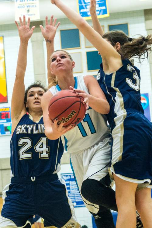 Chris Detrick  |  The Salt Lake Tribune
Sky View's Lindsey Jensen (11) shoots past Skyline's Olivia Elliss (24) and Skyline's Laurel Tomlinson (32)  during the 4A State Championship game at Salt Lake Community College Lifetime Activities Center  Saturday February 21, 2015. Skyview defeated Skyline 43-32.