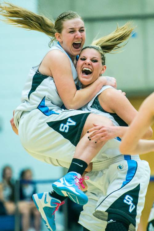 Chris Detrick  |  The Salt Lake Tribune
Sky View's Daisy Karren (31) and Sky View's Lindsey Jensen (11) celebrate after winning the 4A State Championship game at Salt Lake Community College Lifetime Activities Center  Saturday February 21, 2015. Sky View defeated Skyline 43-32.