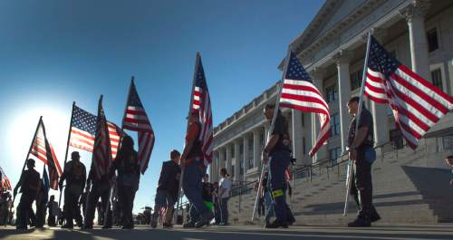 Rick Egan  |  The Salt Lake Tribune

A group of veterans gather at a rally to urge Gov. Herbert to veto HB385, which would name a portion of I-15--known as the Veterans Memorial Highway -- after former Speaker Becky Lockhart, at the Utah State Capitol, Monday, March 30, 2015