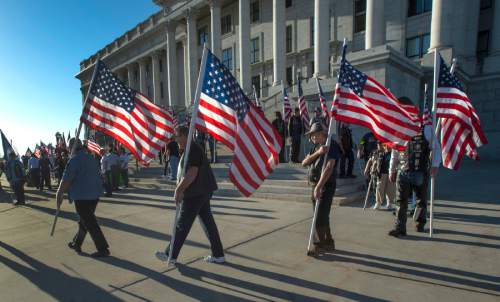 Rick Egan  |  The Salt Lake Tribune

A group of veterans gather at a rally to urge Gov. Herbert to veto HB385, which would name a portion of I-15--known as the Veterans Memorial Highway -- after former Speaker Becky Lockhart, at the Utah State Capitol, Monday, March 30, 2015