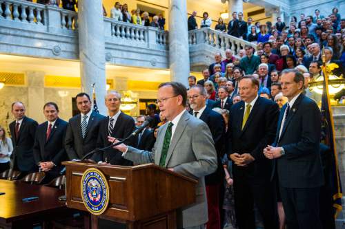 Chris Detrick  |  The Salt Lake Tribune
Majority Whip Stuart Adams, R-Layton, speaks during the ceremony to sign SB296 at the Utah State Capitol Thursday March 12, 2015.