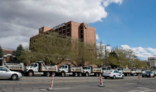 Lennie Mahler  |  The Salt Lake Tribune

A barricade of garbage trucks lines the street in tfront of the Sheraton hotel on 200 West in Salt Lake City, Thursday, April 2, 2015. President Barack Obama is expected to stay at the hotel before speaking at Hill Air Force Base on Friday.