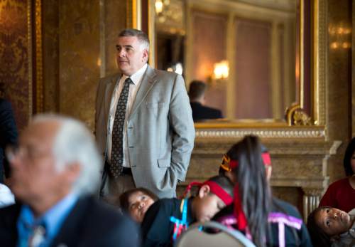 Lennie Mahler  |  The Salt Lake Tribune

State Treasurer Richard Ellis watches as Gov. Gary Herbert signs three bills involving the Utah Navajo community, as children from the Granite School District Title VII American Indian Education program wait to perform a song in the Gold Room at the Utah State Capitol, Monday, March 30, 2015.