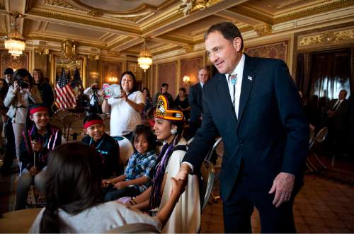 Lennie Mahler  |  The Salt Lake Tribune

Gov. Gary Herbert shakes hands with American Indian Students in the TItle VII program from Granite School District after they performed songs in the Gold Room at the Utah State Capitol on Monday, March 30, 2015.