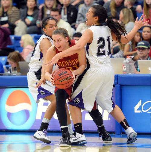 Steve Griffin  |  The Salt Lake Tribune

Viewmont's Katie Toole splits the defense Riverton's Tia Yazzie (10) and Riverton's Kiana Tai (21) as she escapes a trap during second round in the girl's 5A basketball state tournament at SLCC in Taylorsville, Wednesday, February 18, 2015.