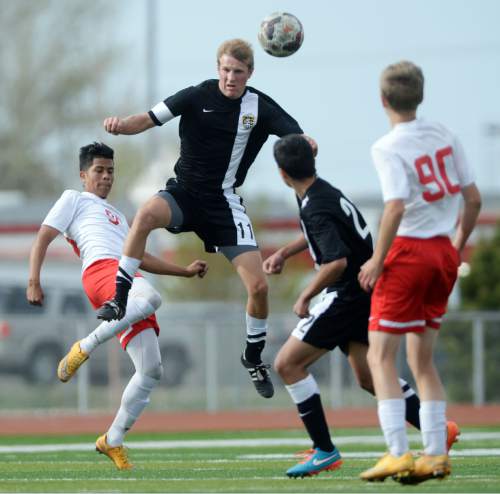 Steve Griffin  |  The Salt Lake Tribune

Cottonwood's Heber Hanks leaps into the air as he reads the ball during the Cottonwood versus Granger boy's soccer game at Granger High School in West Valley City, Tuesday, March 31, 2015.