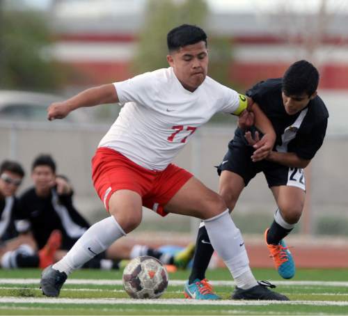 Steve Griffin  |  The Salt Lake Tribune

Granger's Uriei Heredia, left, keeps Cottonwood's Matthew Orme away from the ball during the Cottonwood versus Granger boy's soccer game at Granger High School in West Valley City, Tuesday, March 31, 2015.