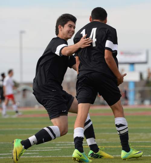 Steve Griffin  |  The Salt Lake Tribune

Cottonwood's Daniel Darrelli, left, embraces Omar Villanueva after Villanueva converted on a goal in the final minute of game against Granger giving Cottonwood a victory over the previously undefeated Lancers at Granger High School in West Valley City, Tuesday, March 31, 2015.