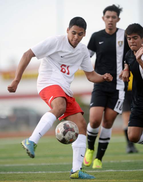 Steve Griffin  |  The Salt Lake Tribune

Granger's Josue Resendiz clears the ball during the Cottonwood at Granger boy's soccer game in West Valley City, Tuesday, March 31, 2015.