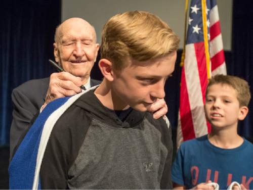 Rick Egan  |  The Salt Lake Tribune
Gail Halvorsen, 94 years old and known around the world as the Berlin Candy Bomber, signs Richie Saunders' sweater as Jake Sexton waits his turn at Oquirrh Hills Middle School on Wednesday.