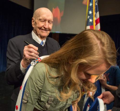 Rick Egan  |  The Salt Lake Tribune

Gail Halvorsen, 94 years old and known around the world as the Berlin Candy Bomber, autographs Eve Barlow's sweater at Oquirrh Hills Middle School, Wednesday, April 1, 2015.