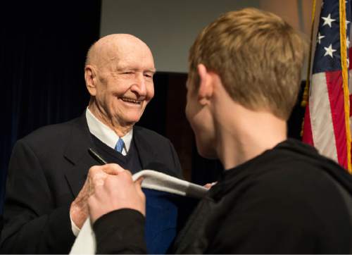 Rick Egan  |  The Salt Lake Tribune

Gail Halvorsen, 94 years old and known around the world as the Berlin Candy Bomber, signs Richie Saunders' sweater at Oquirrh Hills Middle School, Wednesday, April 1, 2015.