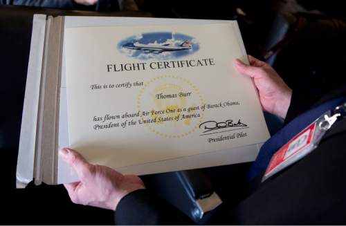 Thomas Burr with the The Salt Lake Tribune, boards Air Force One, Thursday, April 2, 2015, in Andrews Air Force Base, Md., en route to Louisville, Ky., where he will report on President Barack Obama as he tours and speak at Indatus, a Louisville-based technology company that specializes in cloud-based products and services. The president will discuss his concerns about $300 billion cost of eliminating a tax that the White House says would affect relatively few people. (AP Photo/Carolyn Kaster)