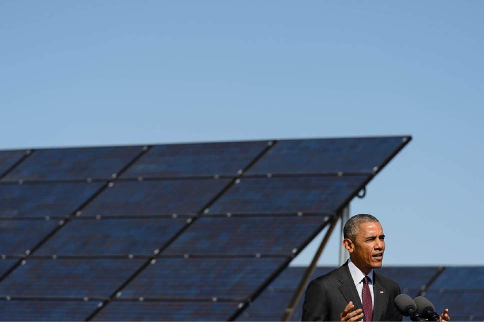 Trent Nelson  |  The Salt Lake Tribune
Standing in front of an array of solar panels, President Barack Obama announces a series of solar power initiatives at Hill Air Force Base, Friday April 3, 2015.