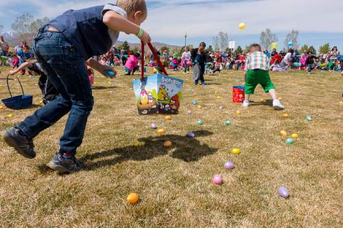 Trent Nelson  |  The Salt Lake Tribune
Children scramble to pick up eggs at Thanksgiving Point's Easter Eggstreme, Saturday April 4, 2015.