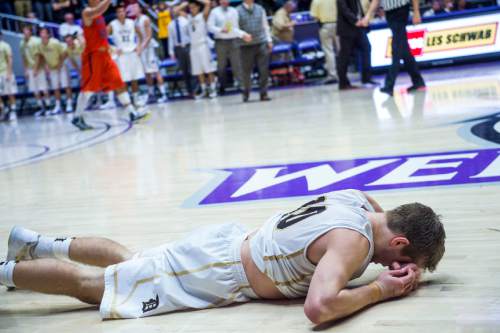 Chris Detrick  |  The Salt Lake Tribune
Davis' Jesse Wade (10) remains on the court after missing the potential game-winning three-point shot at the buzzer during the 5A semifinal game at the Dee Events Center Friday February 27, 2015.  Brighton defeated Davis 64-62.