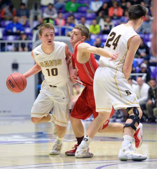 Steve Griffin  |  The Salt Lake Tribune

Davis' Jesse Wade (10) runs Granger's Jordan Ainslie (11) through a screen set by Davis' Caleb Leonhardt (24) during the opening round of the boy's 5A basketball state tournament game at the Dee Events Center in Ogden, Monday, February 23, 2015.