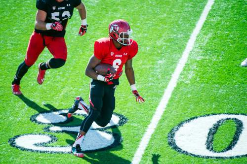 Chris Detrick  |  The Salt Lake Tribune
Utah Utes running back Bubba Poole (8) runs for a touchdown during a practice at Rice-Eccles Stadium Friday April 3, 2015.