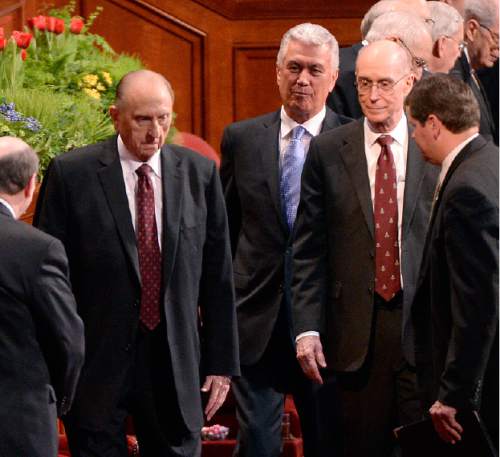 Al Hartmann  |  The Salt Lake Tribune 
President Thomas S. Monson, left, Second Counselor Dieter F. Uchtdorf and First Counselor Henry B. Eyring enter the LDS Conference Center on Easter Sunday April 5, 2015, for the second day of the 185th Annual LDS General Conference.