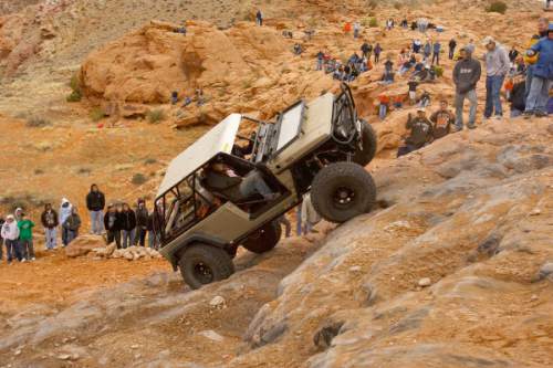 Moab - A 4x4 climbs up Potato Salad Hill. Thousands of Jeeps descended on the trails surrounding Moab for the annual Easter Jeep Safari, Saturday April 11, 2009.
Trent Nelson/The Salt Lake Tribune; 4.11.2009.